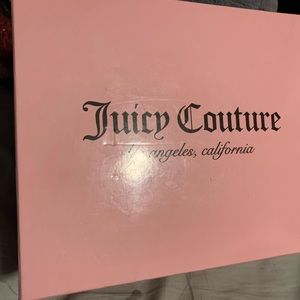 Juicy Couture mini backpack with pink flower design.